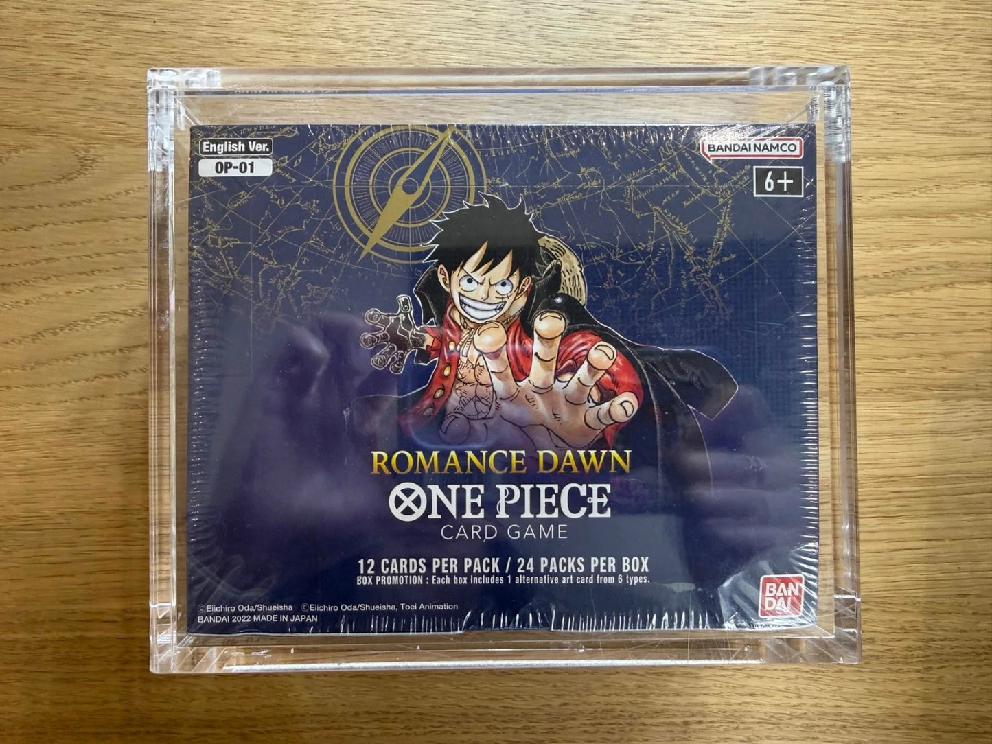 One Piece TCG Romance Dawn Booster Box W/ Acrylic Case (White Bottom) (Sealed)