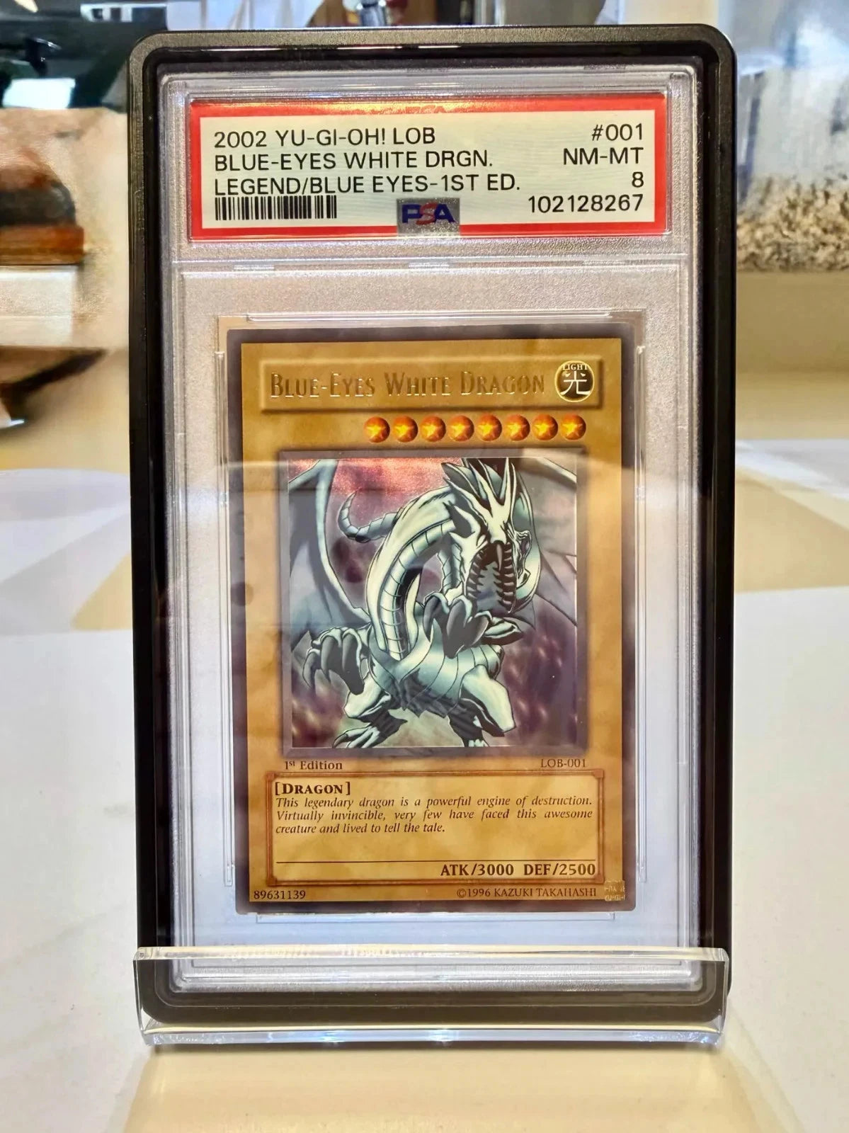 Yugioh - Blue-eyes White Dragon LOB-001 1st Ed 2002 PSA 8