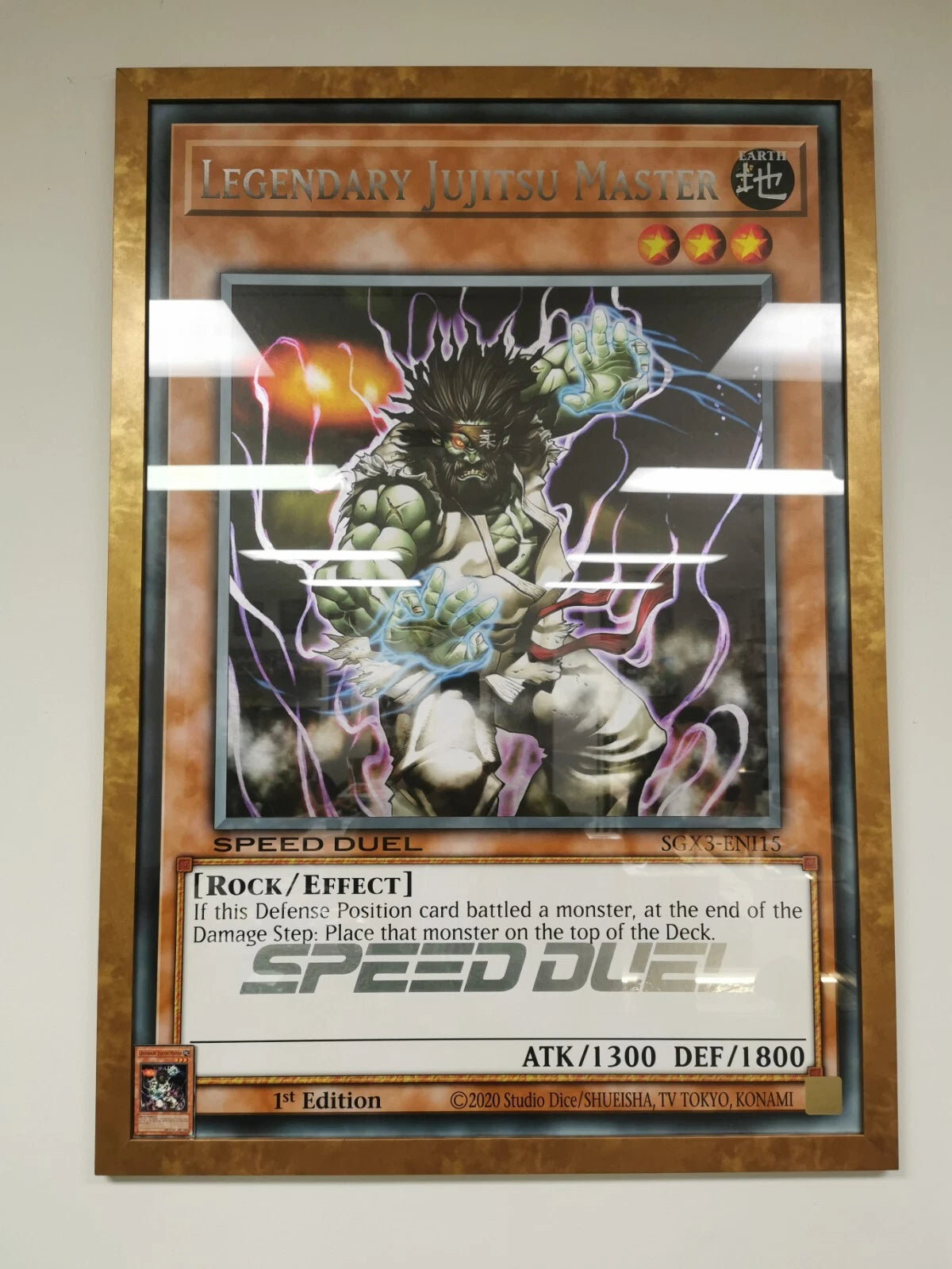 YUGIOH Giant Card Legendary Jujitsu Master SGX3 framed with glass and gold frame
